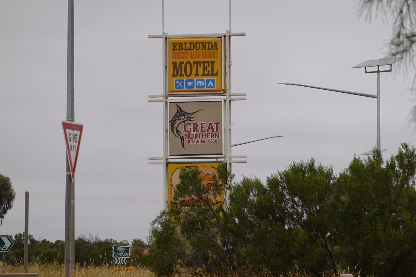 Roadside signs for the Erldunda Motel.