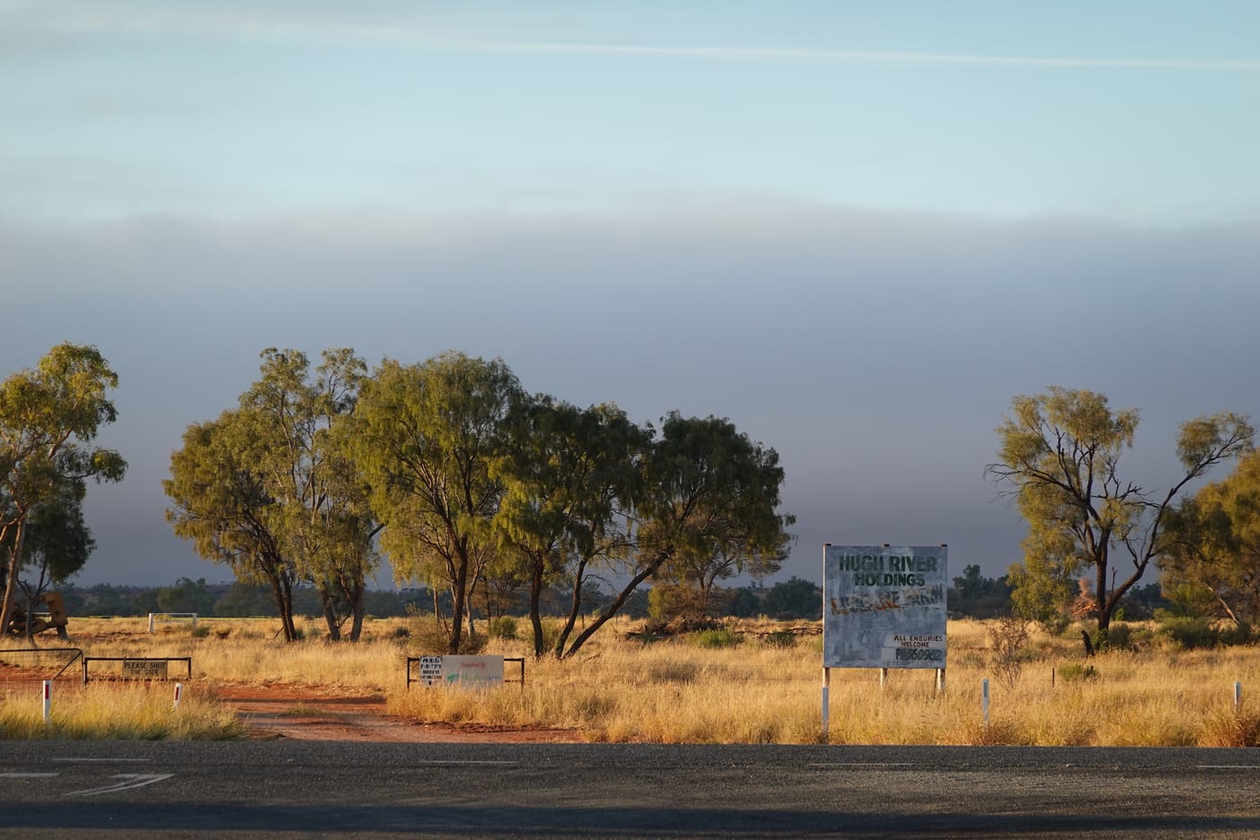Roadside sign in early dawn light.