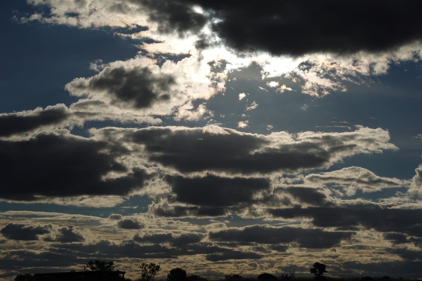 Dramatic clouds with sun breaking through.
