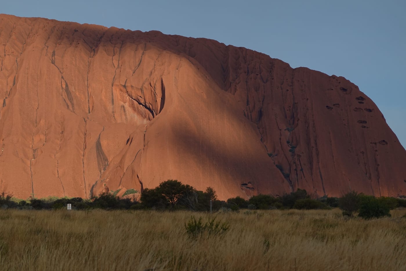 Side profile of Uluru in evening light.