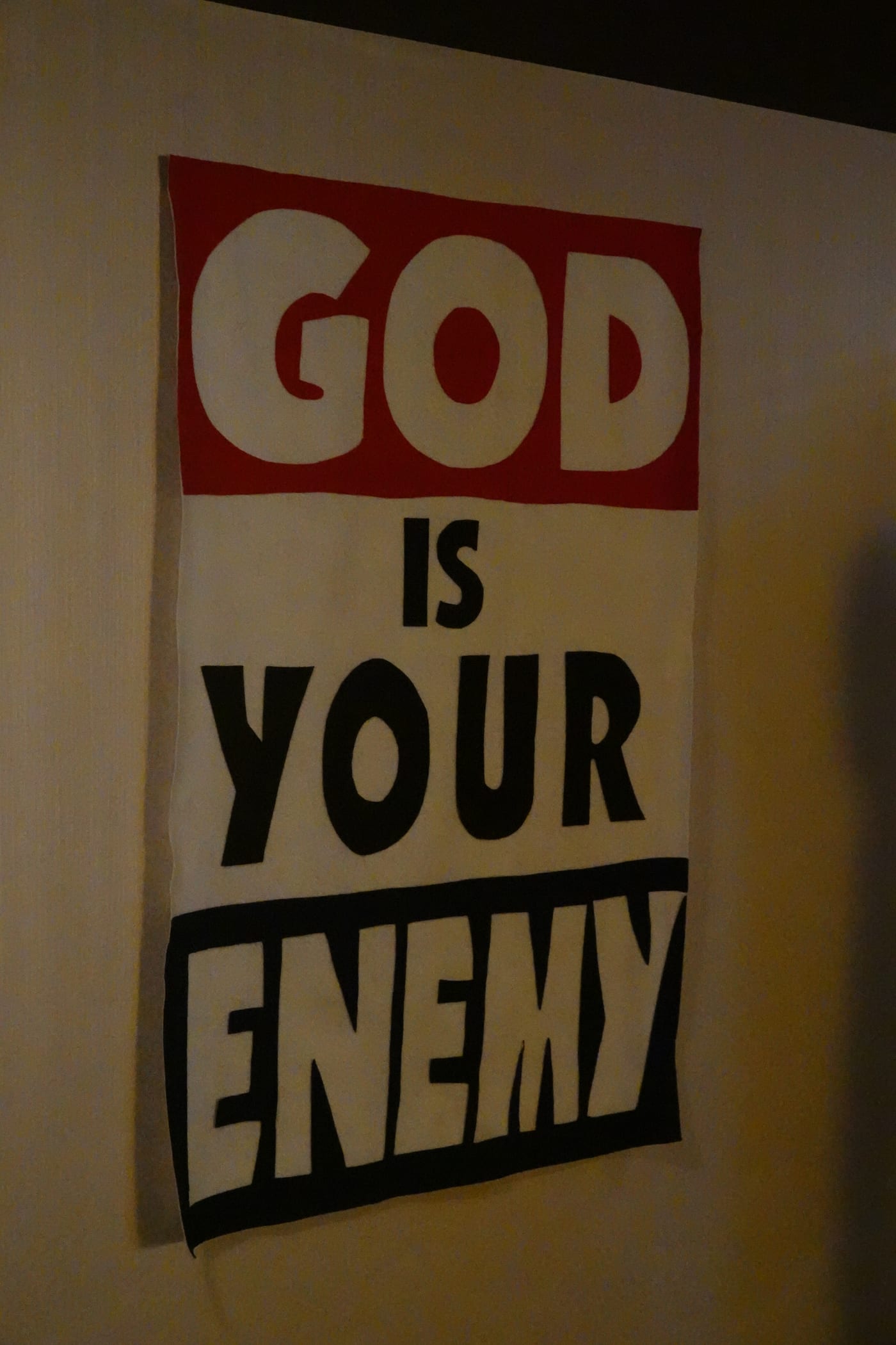 'God Is Your Enemy' text artwork.
