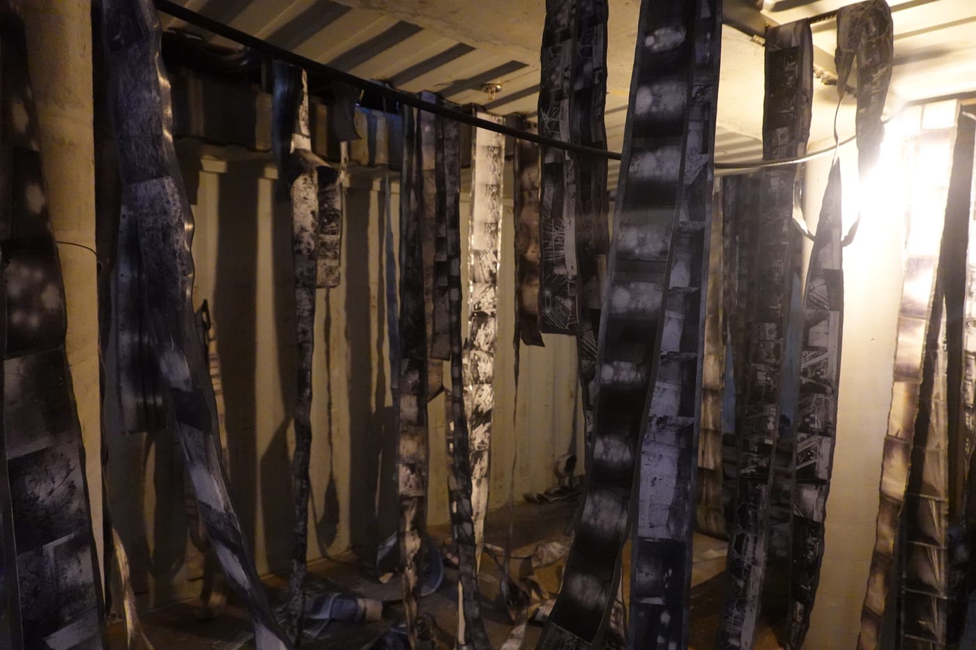 Hanging strips of burnt film.