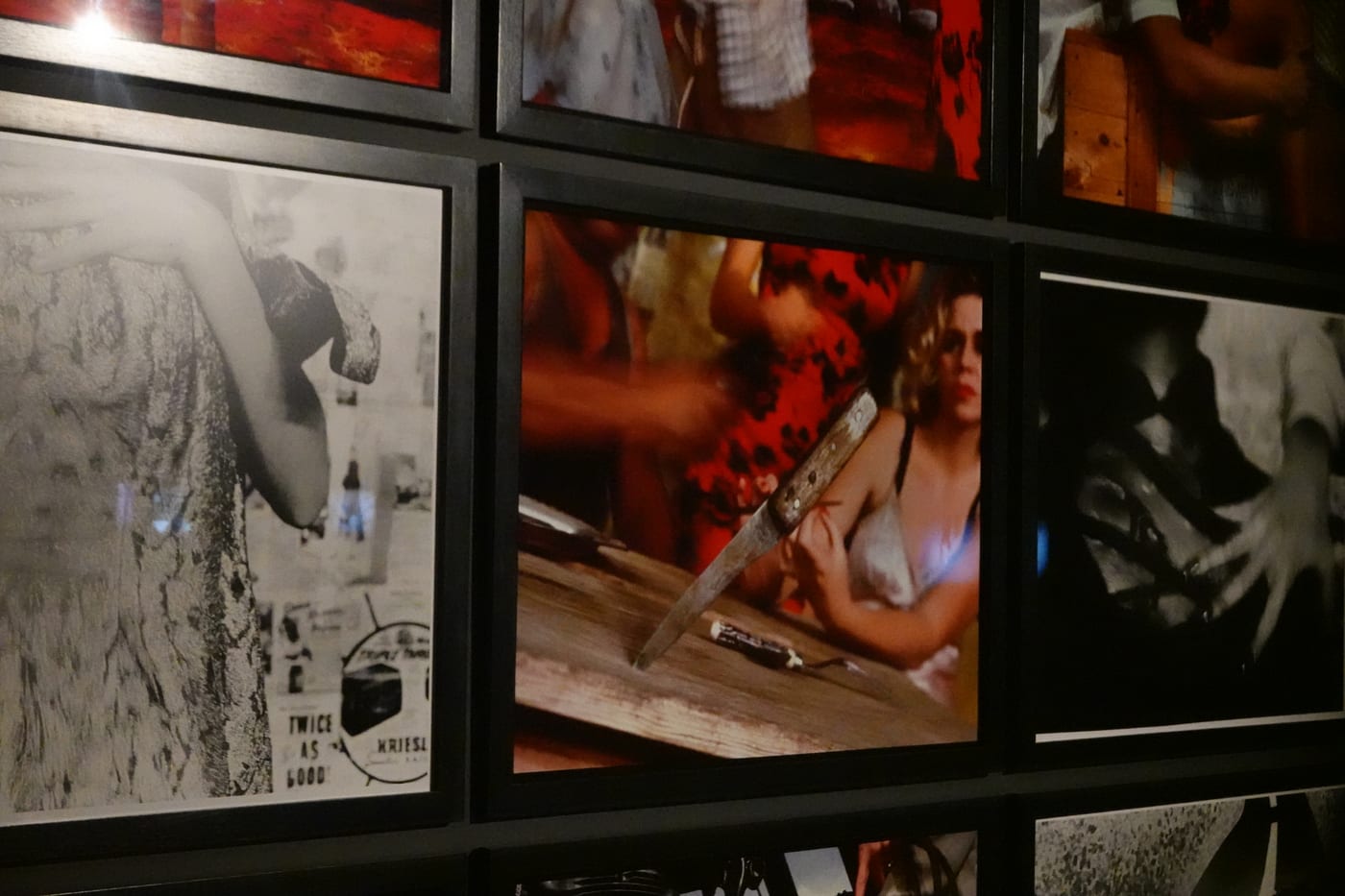 Wall of framed photographs.