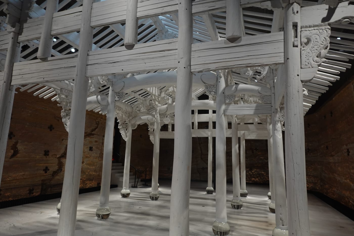 Carved white timber temple installation.